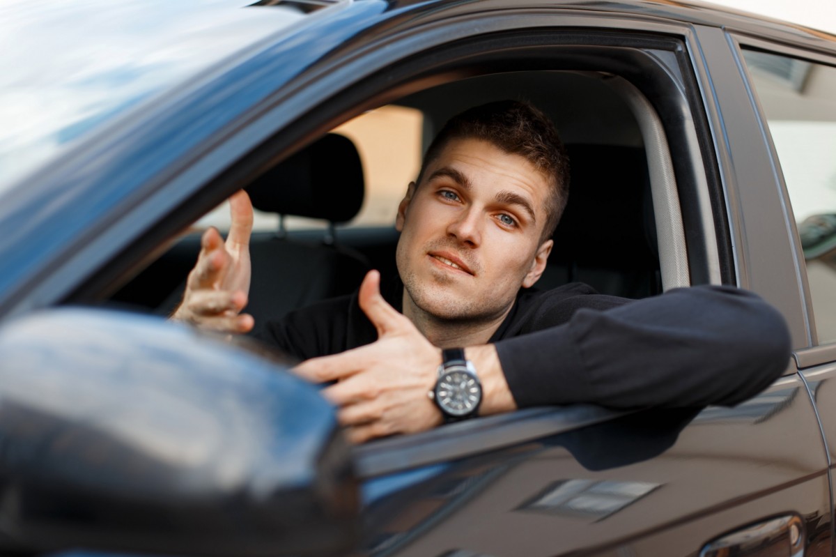 man in car